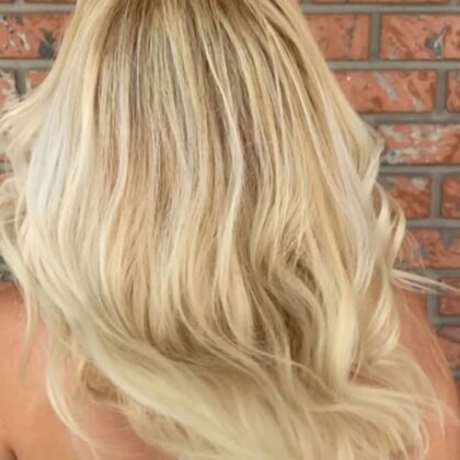 Dimensional blonde balayage with soft waves - Millionaire Hair Salon Winter Garden FL